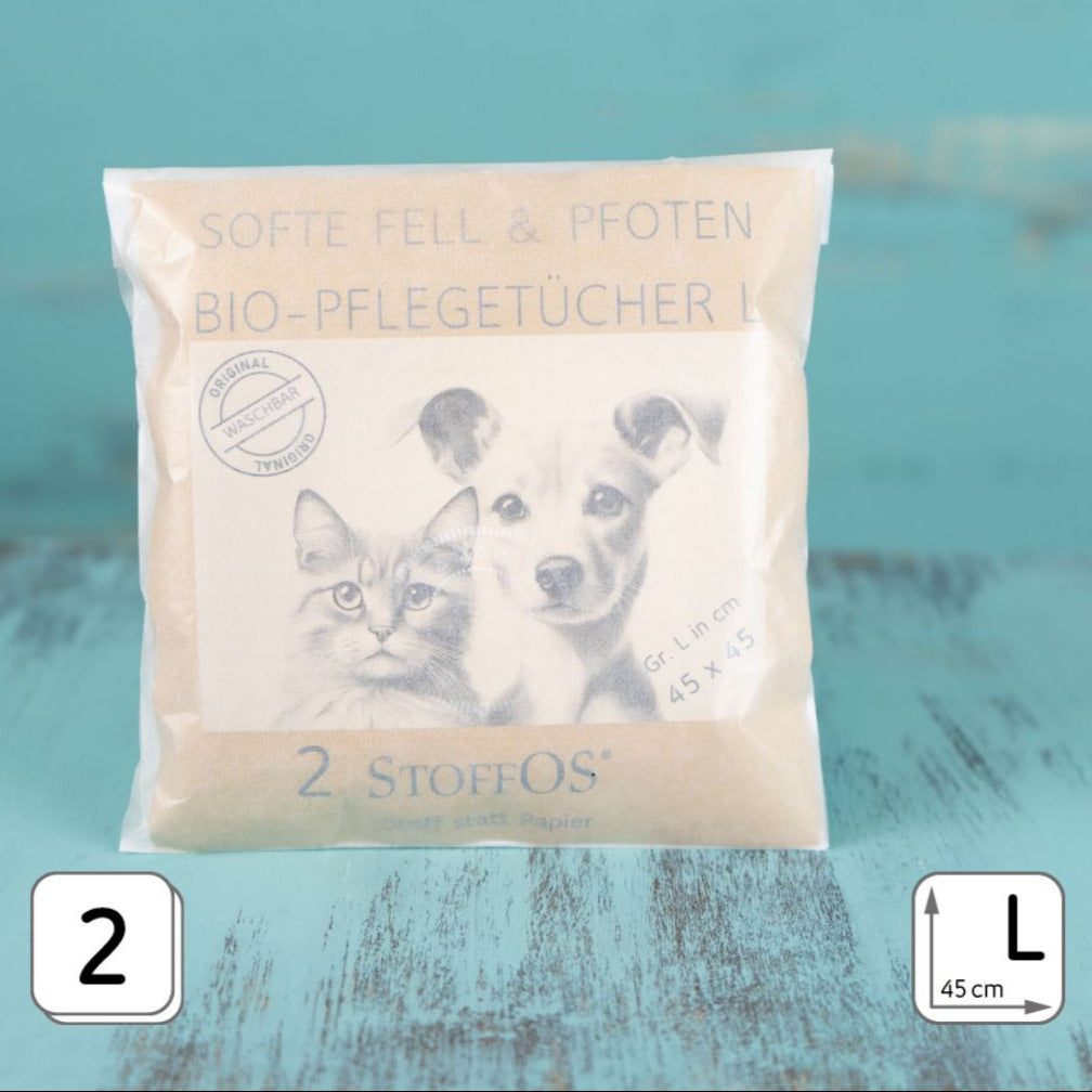 Auf der Verpackung der zwei weißen Pflegetücher für Tierpflege sind ein gezeichnter Hundekopf neben einermgezeichneten Katzenkopf abgebildet.