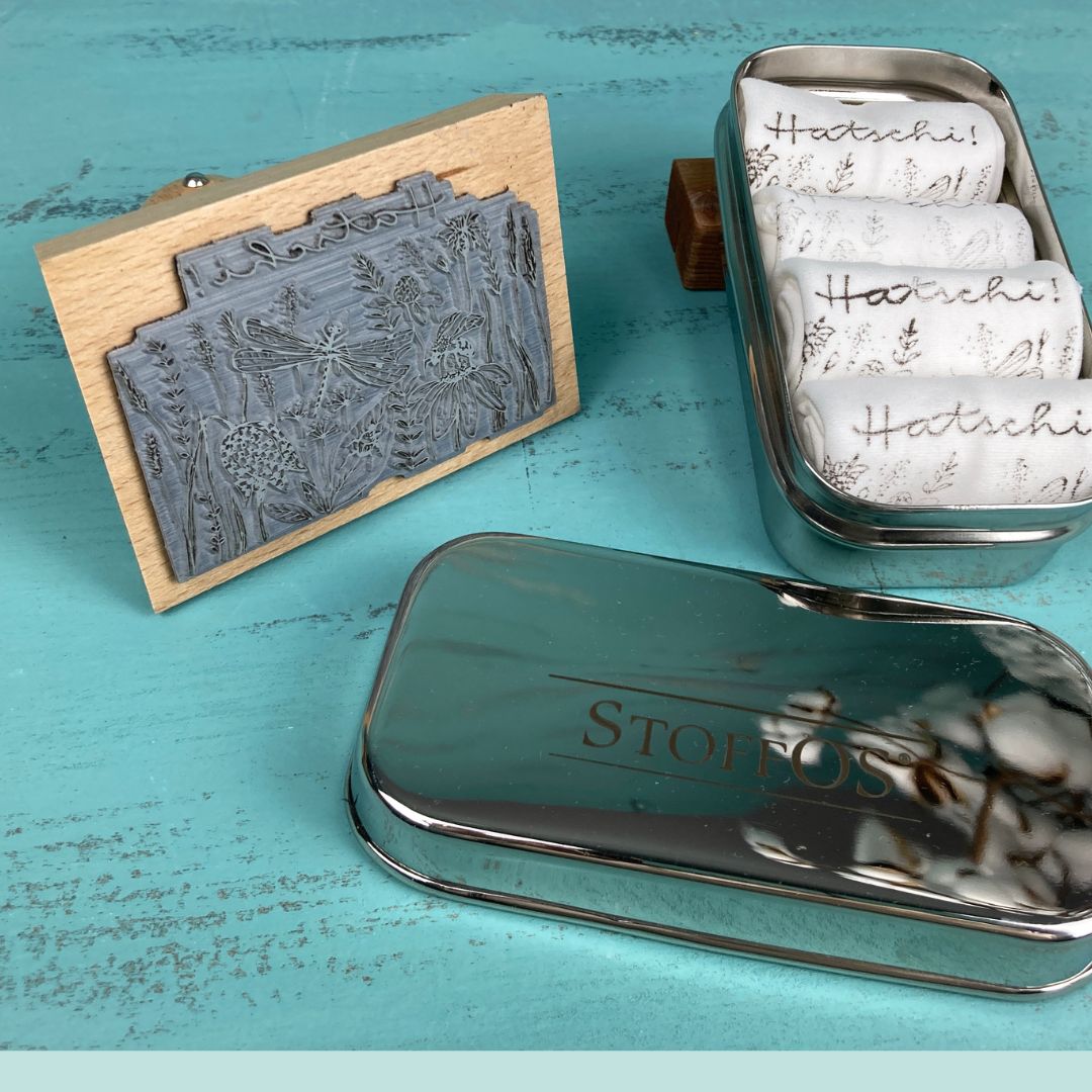 Tiny stainless steel box with 4 StoffOS